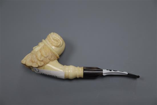 A Dieppe ivory cherub and a bone and horn smoking pipe, length 15cm